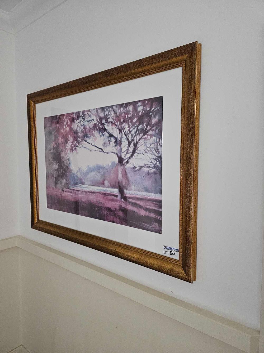 Lot 512: A Framed Landscape Print of a Tree in Purple and Pink Tones