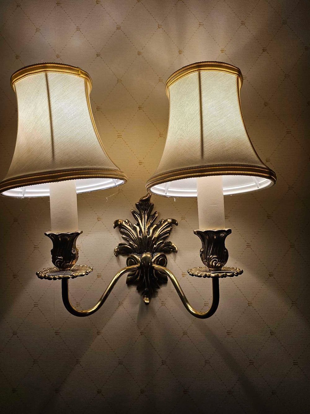 Lot 514: A Colonial Revival Style Double-Arm Brass-Toned Wall Sconce, Circa 1920s