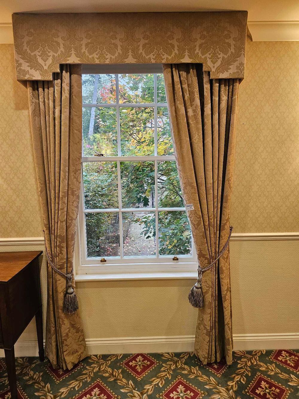 Lot 522: A Pair of Muted Gold Jacquard Curtains with Coordinating Pelmet and Tie-backs