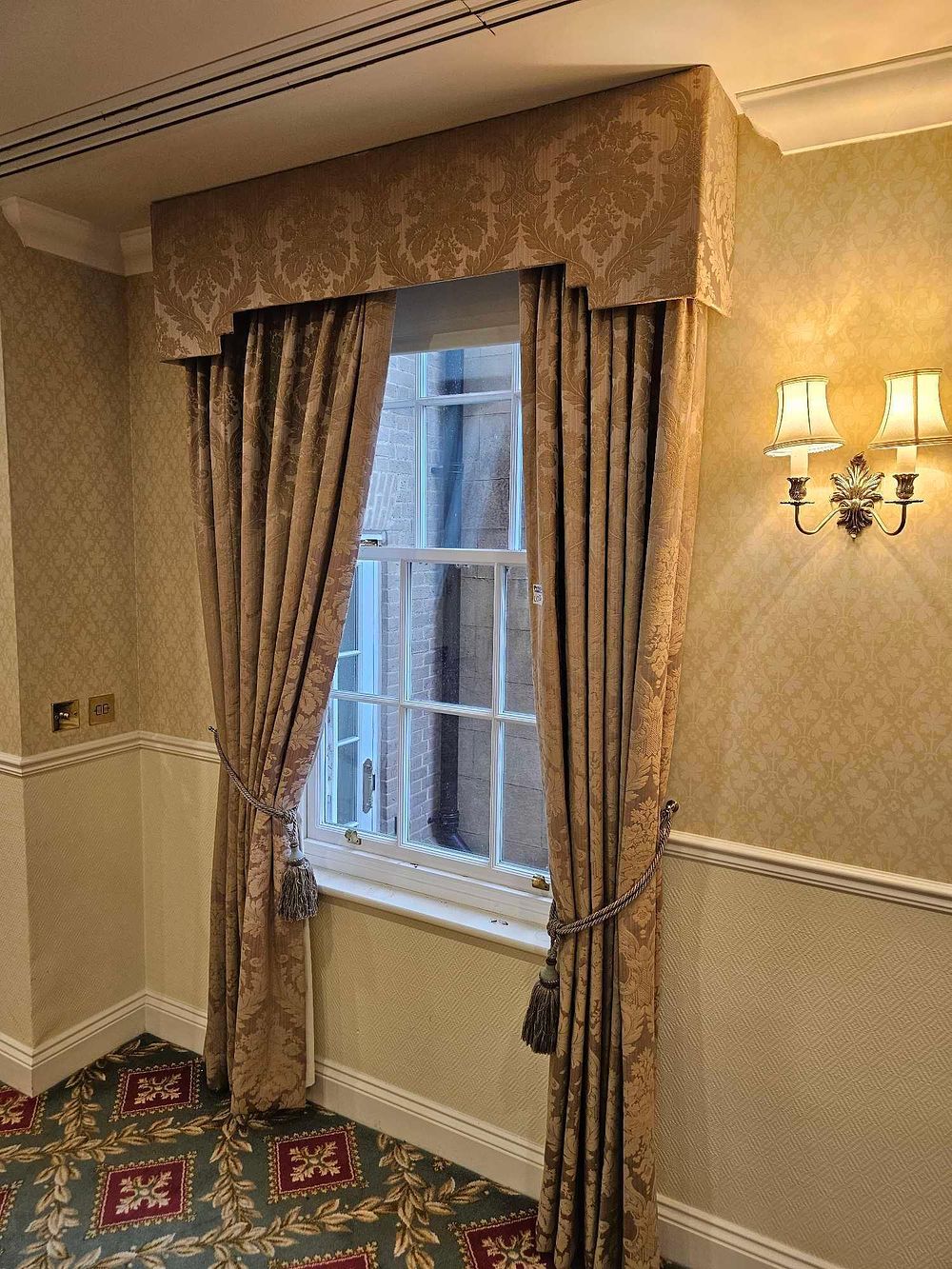 Lot 526: A Pair of Muted Gold Damask or Brocade Curtains with Matching Pelmet and Tie-Backs