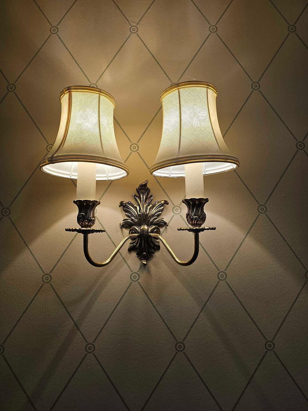 Lot 540: A Brass-Toned Double-Arm Wall Sconce in Traditional Style