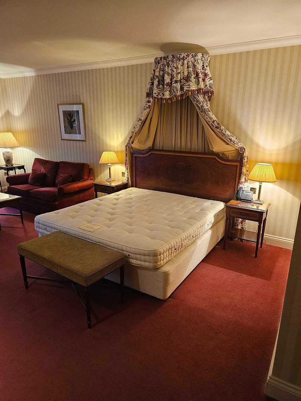 Lot 552: A Collection of Revival Style Furnishings, including a Half-Tester Bed, from a Parkland Deluxe Room at Luton Hoo Hotel Golf and Spa