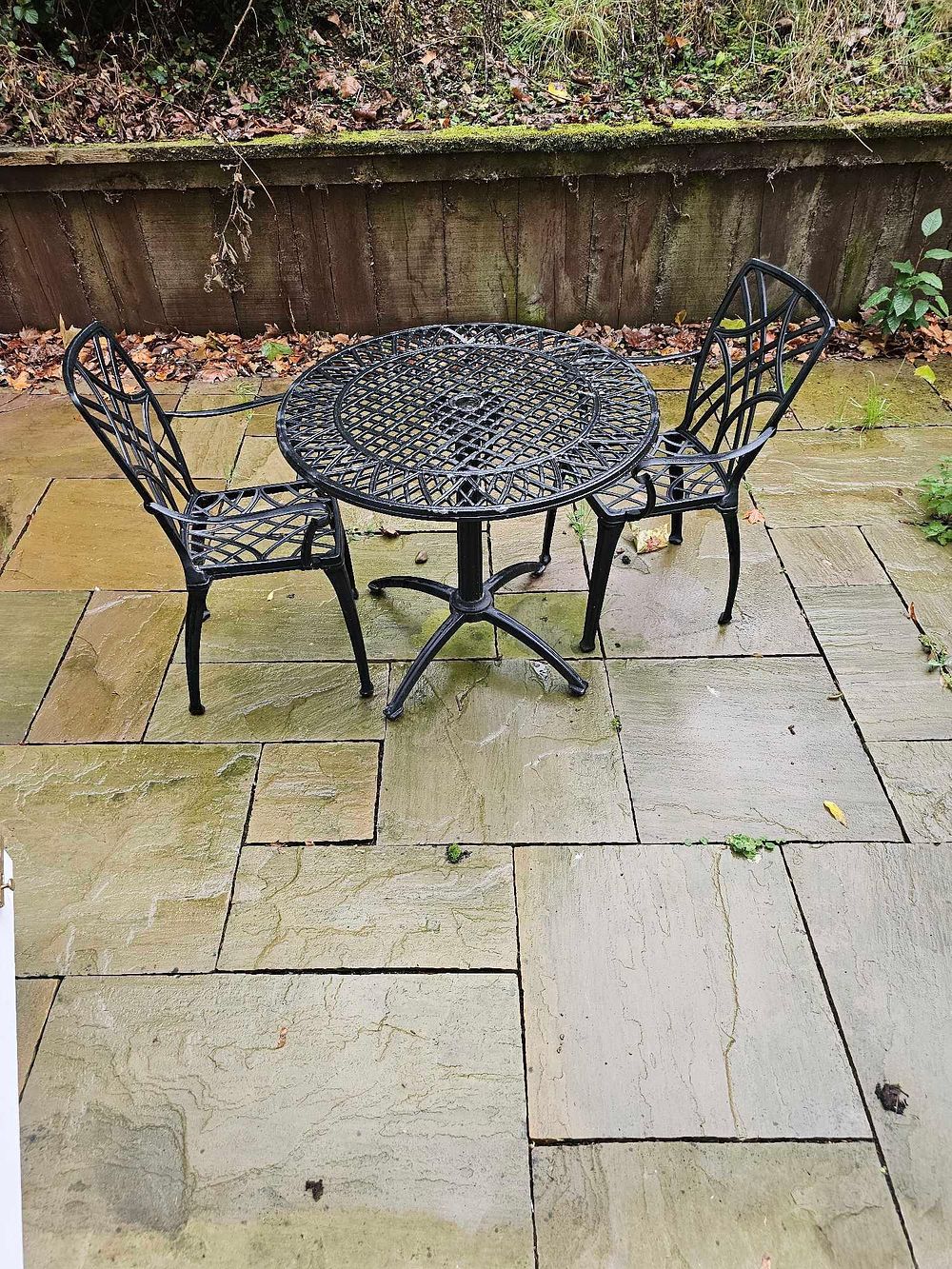 Lot 586: A Three-Piece Black Cast Metal Garden Bistro Set