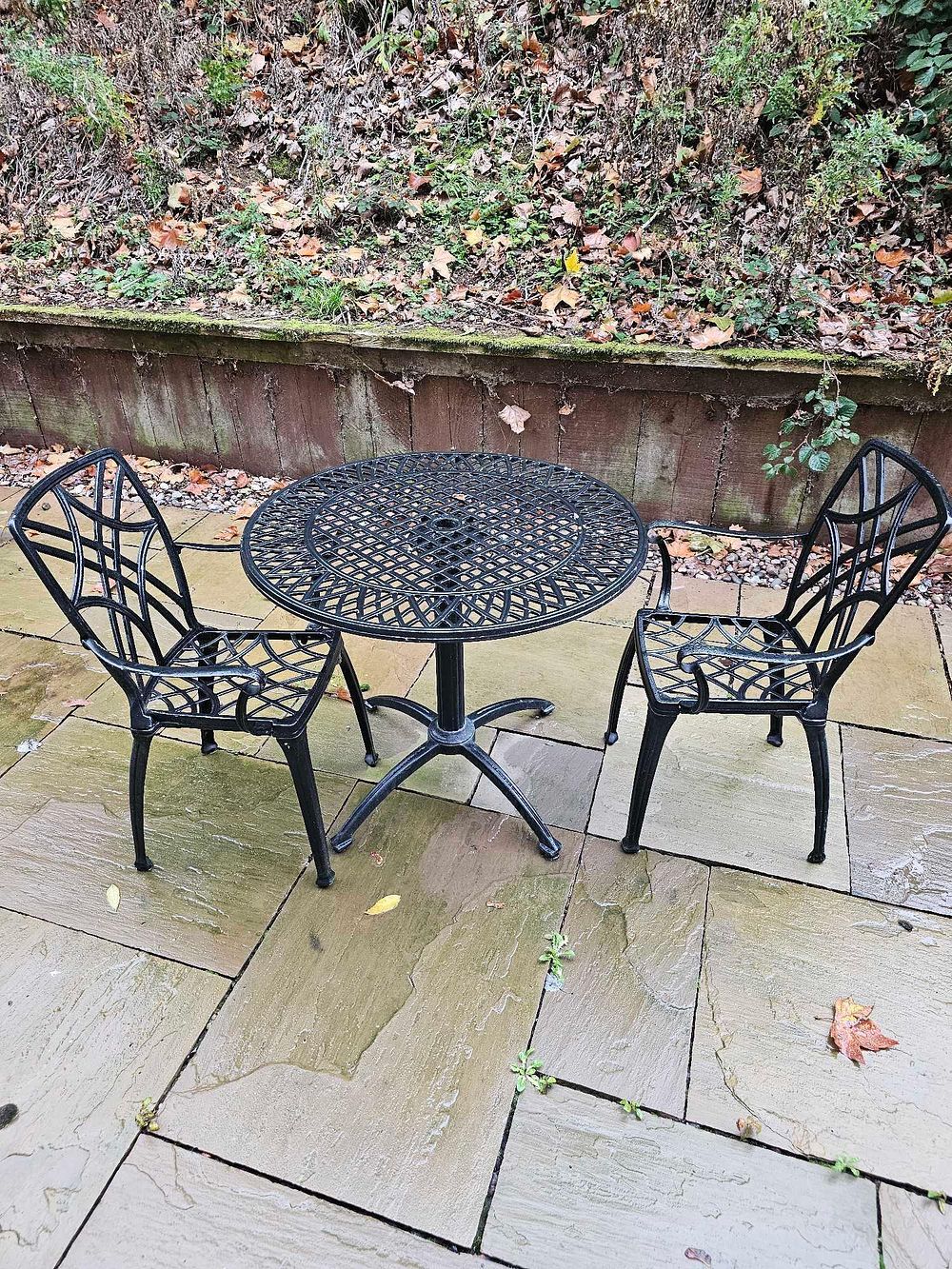 Lot 591: A Black Cast Aluminium Three-Piece Outdoor Bistro Set