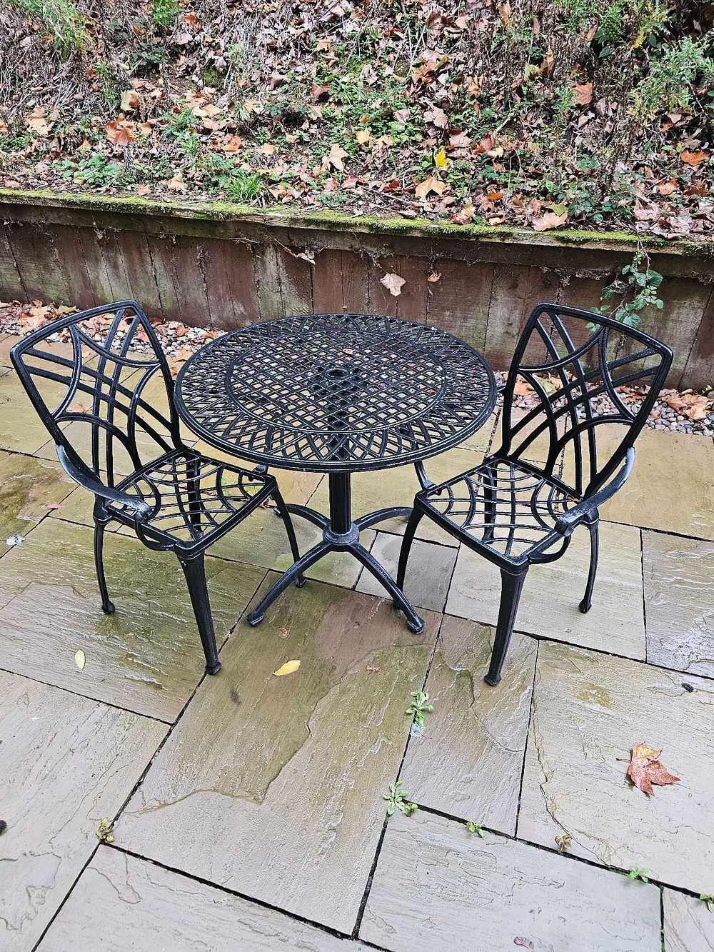 Lot 592: Black Three-Piece Cast Aluminum Outdoor Bistro Set