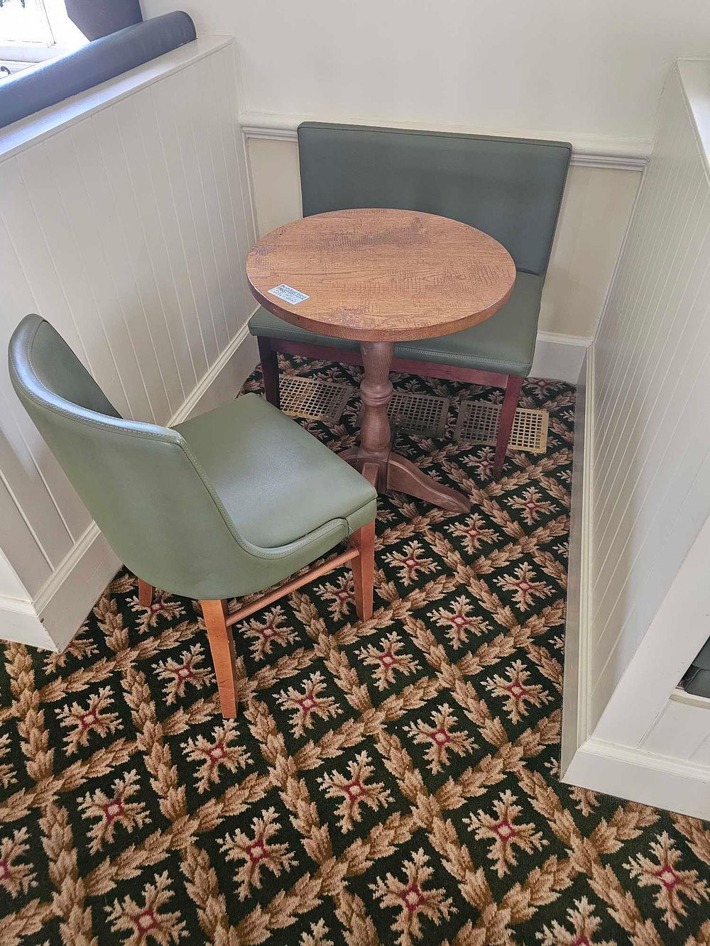 Lot 611: A Three-Piece Mid-Century Modern Inspired Cafe Dining Set, comprising an Oak Pedestal Table, Chair, and Banquette