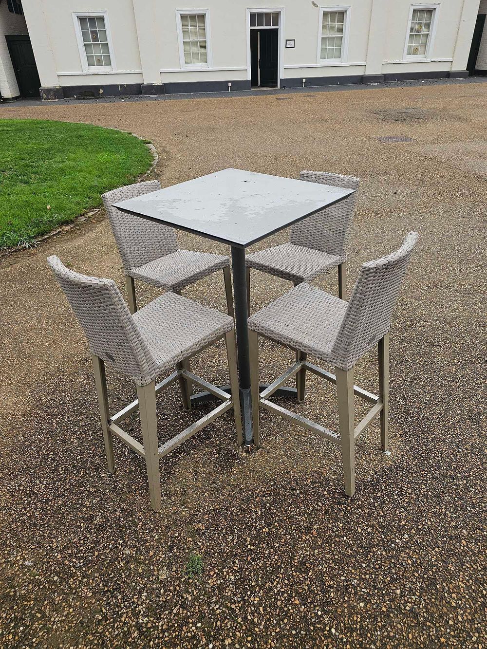 Lot 639: A Five-Piece Contemporary Outdoor Bar-Height Dining Set