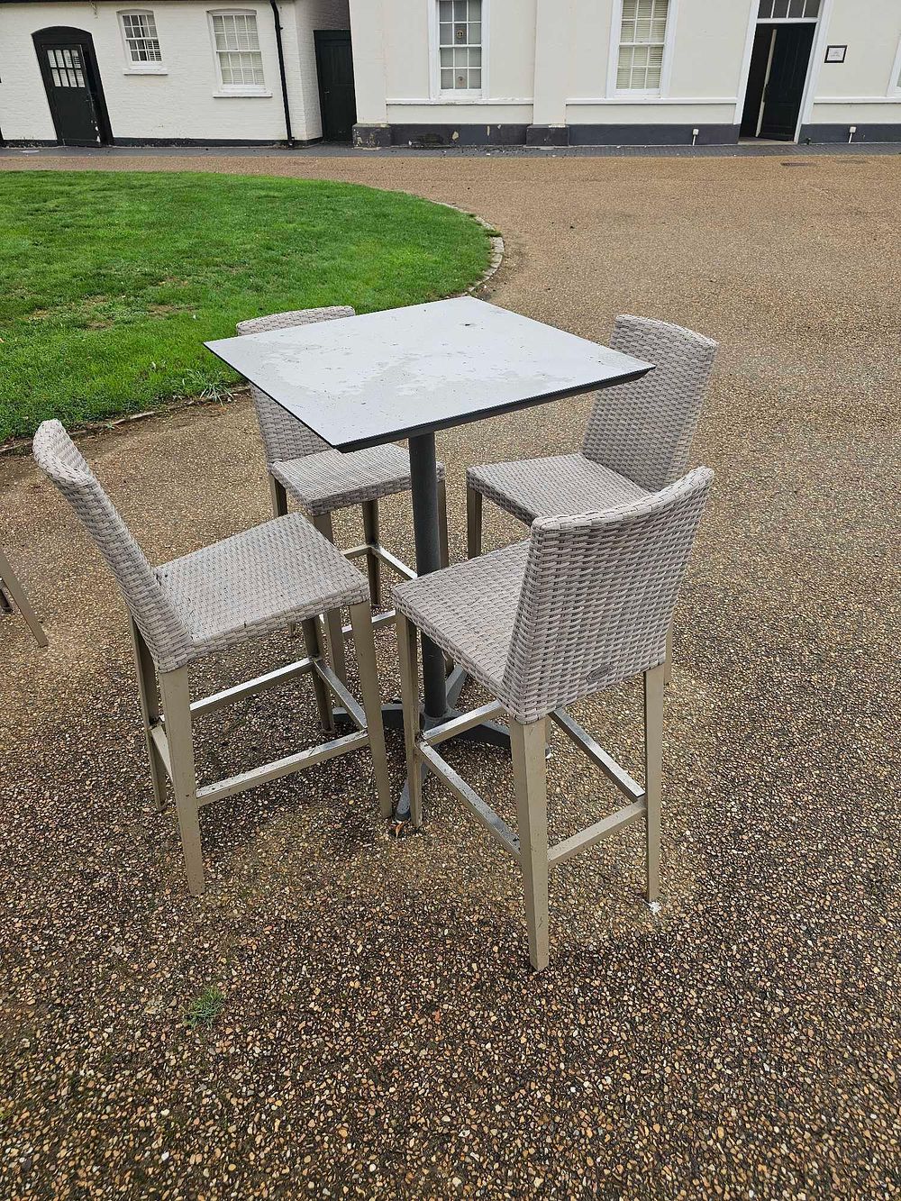 Lot 640: A Five-Piece Outdoor Bar Height Dining Set