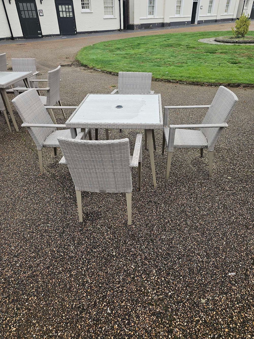 Lot 650: A Set of Five Contemporary Outdoor Wicker Dining Furniture