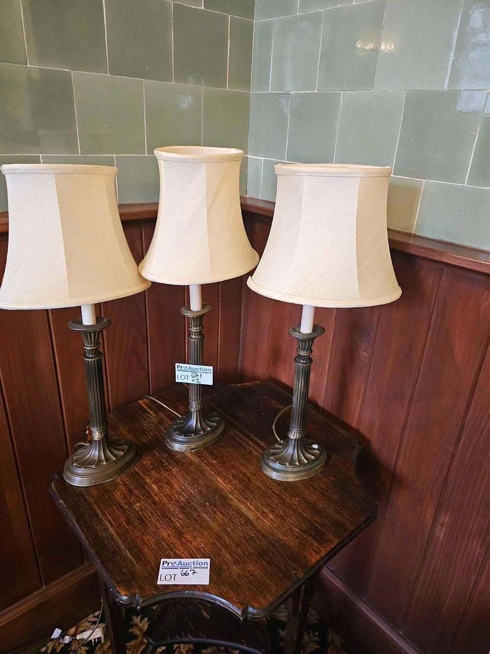 Lot 671: A Set of Three Neoclassical Revival Style Patinated Metal Column Table Lamps