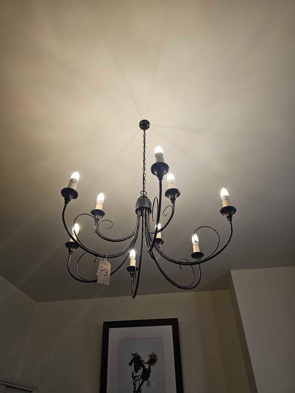 Lot 673: An Eight-Light Rustic Farmhouse Style Chandelier