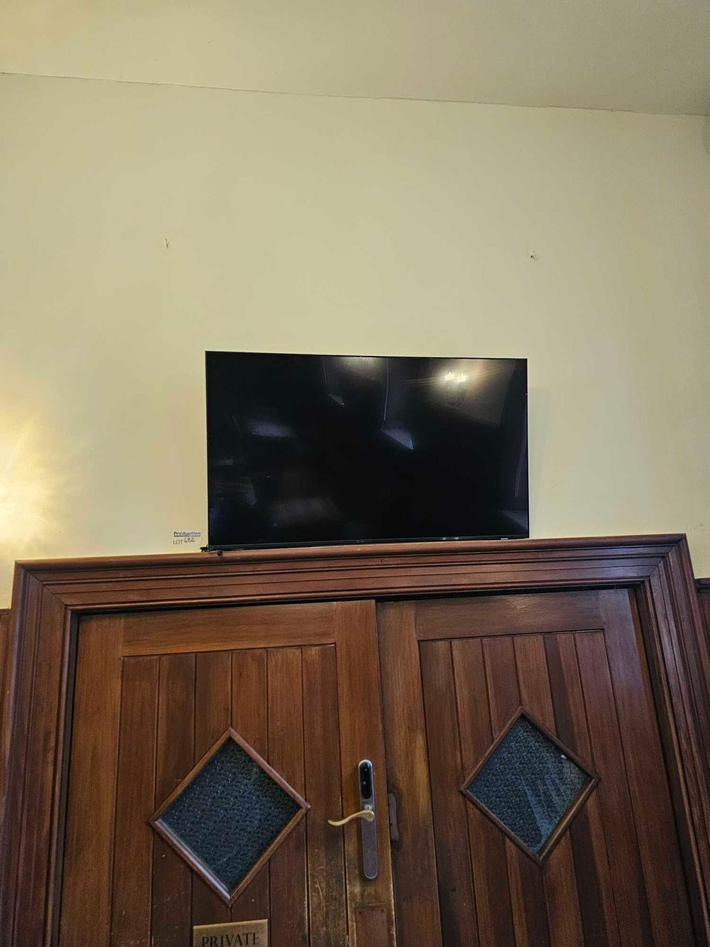 Lot 682: A Contemporary Black Flat-Screen 4K UHD Smart LED Television