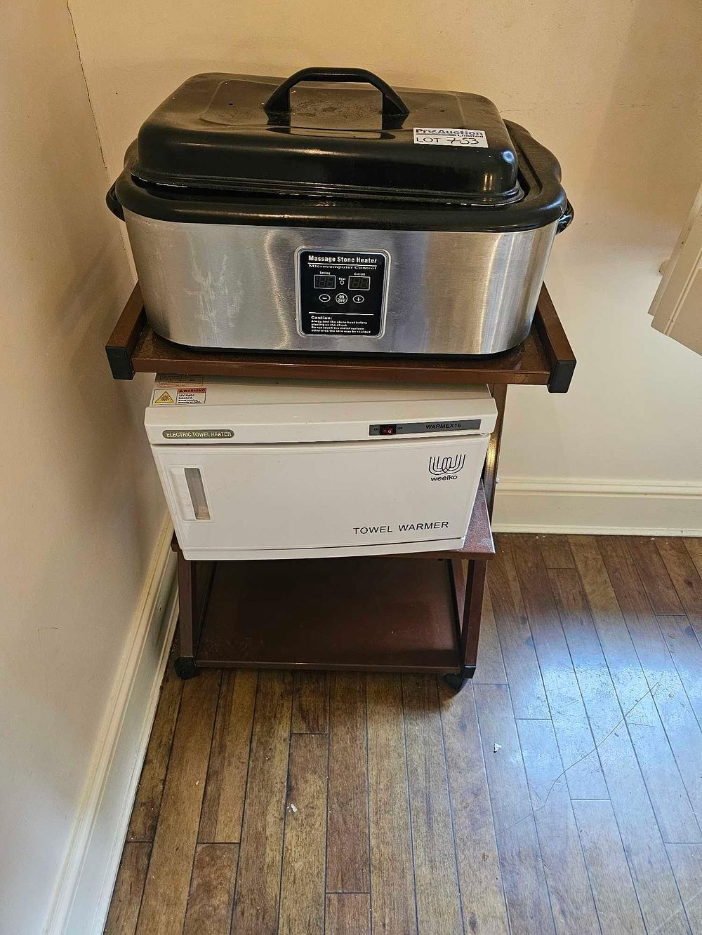 Lot 753: A Professional Hot Stone Heater, a Weelko WARMEX16 Towel Warmer, a Utility Cart, and a Pair of Modular Storage Cabinets