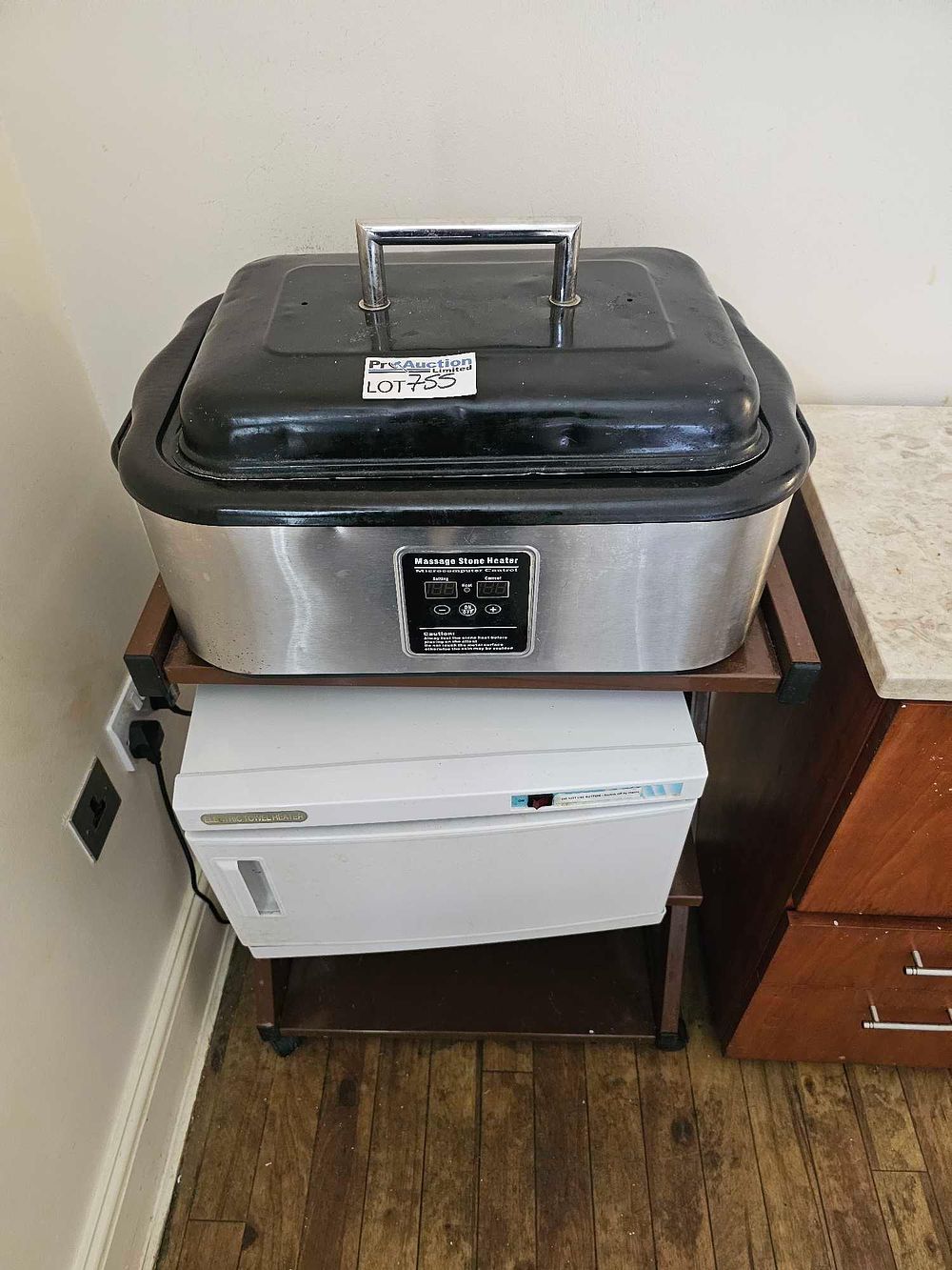 Lot 755: A Group of Professional Spa Equipment, including an 18 Quart Digital Hot Stone Warmer, Electric Towel Heater, Utility Cart, and Cabinet