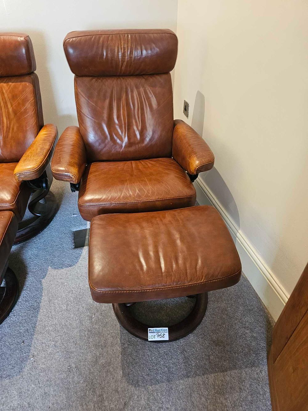Lot 758: Ekornes Stressless Consul Leather Recliner and Ottoman