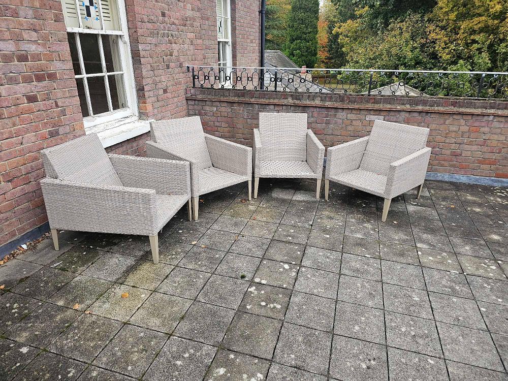 Lot 772: A Set of Four Crosley Furniture Capella Outdoor Wicker Armchairs