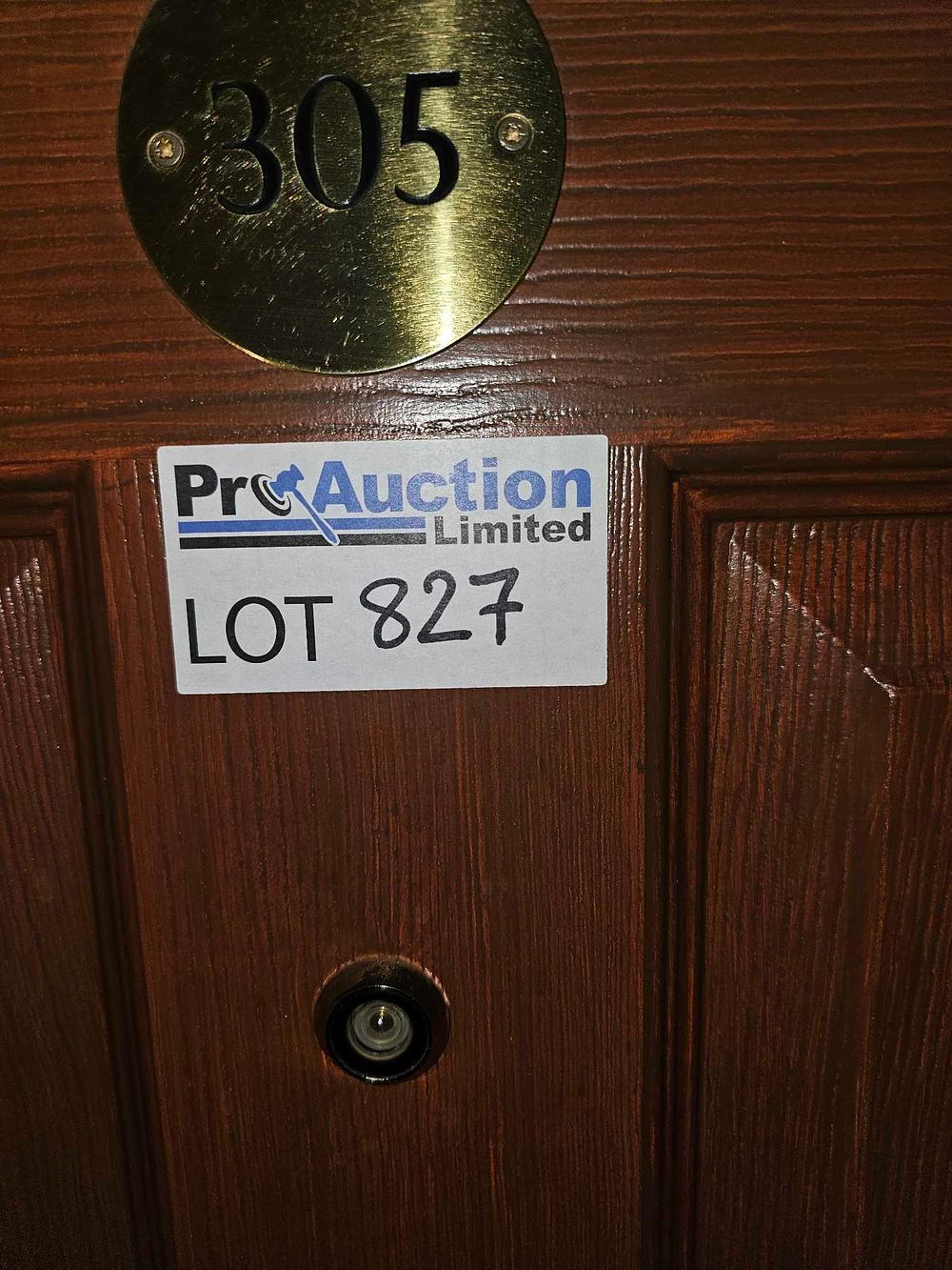 Lot 827: A Paneled Wooden Door with Brass Number Plate '305'