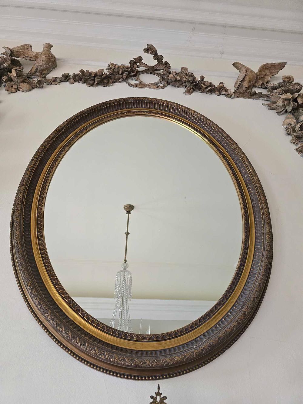 Lot 2037: A Gilt and Patinated Oval Wall Mirror, in Classical Revival Style