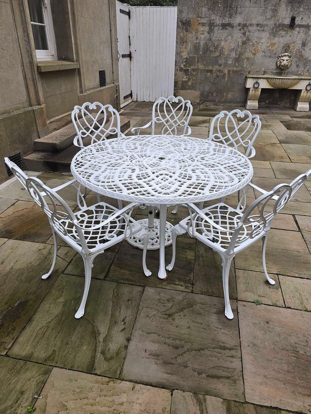 Lot 2089: A Homestyles Sanibel White Cast Aluminum Seven-Piece Outdoor Dining Set