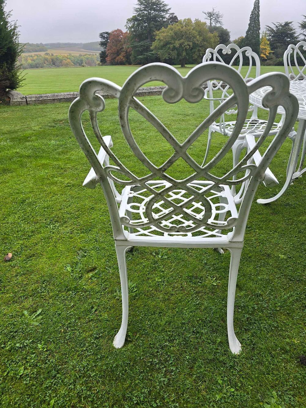 Lot 2091: A Victorian Style Cast Aluminium Oval Dining Set with Eight Armchairs