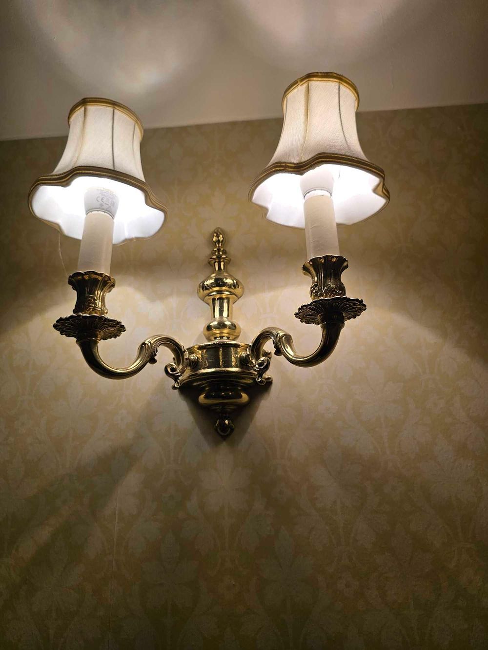 Lot 2172: A Pair of Rococo Revival Brass-Toned Twin-Arm Wall Sconces