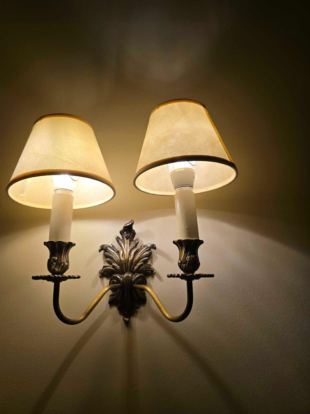 Lot 2218: A Rococo Revival Style Patinated Brass Double-Arm Wall Sconce