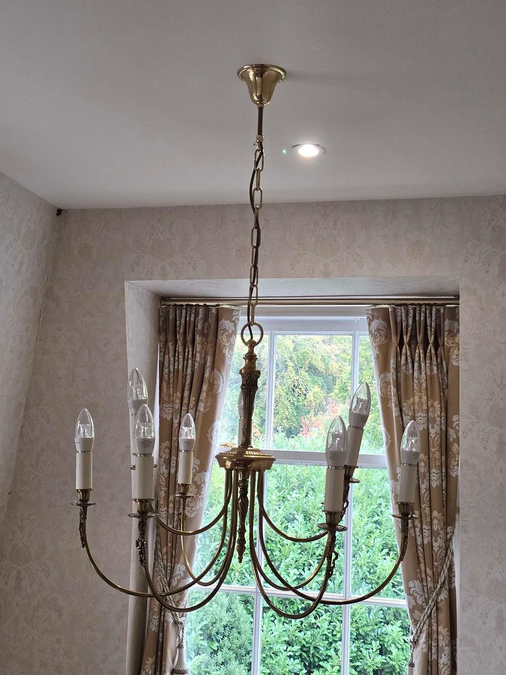 Lot 2246: A French Country Style Eight-Arm Brass Chandelier
