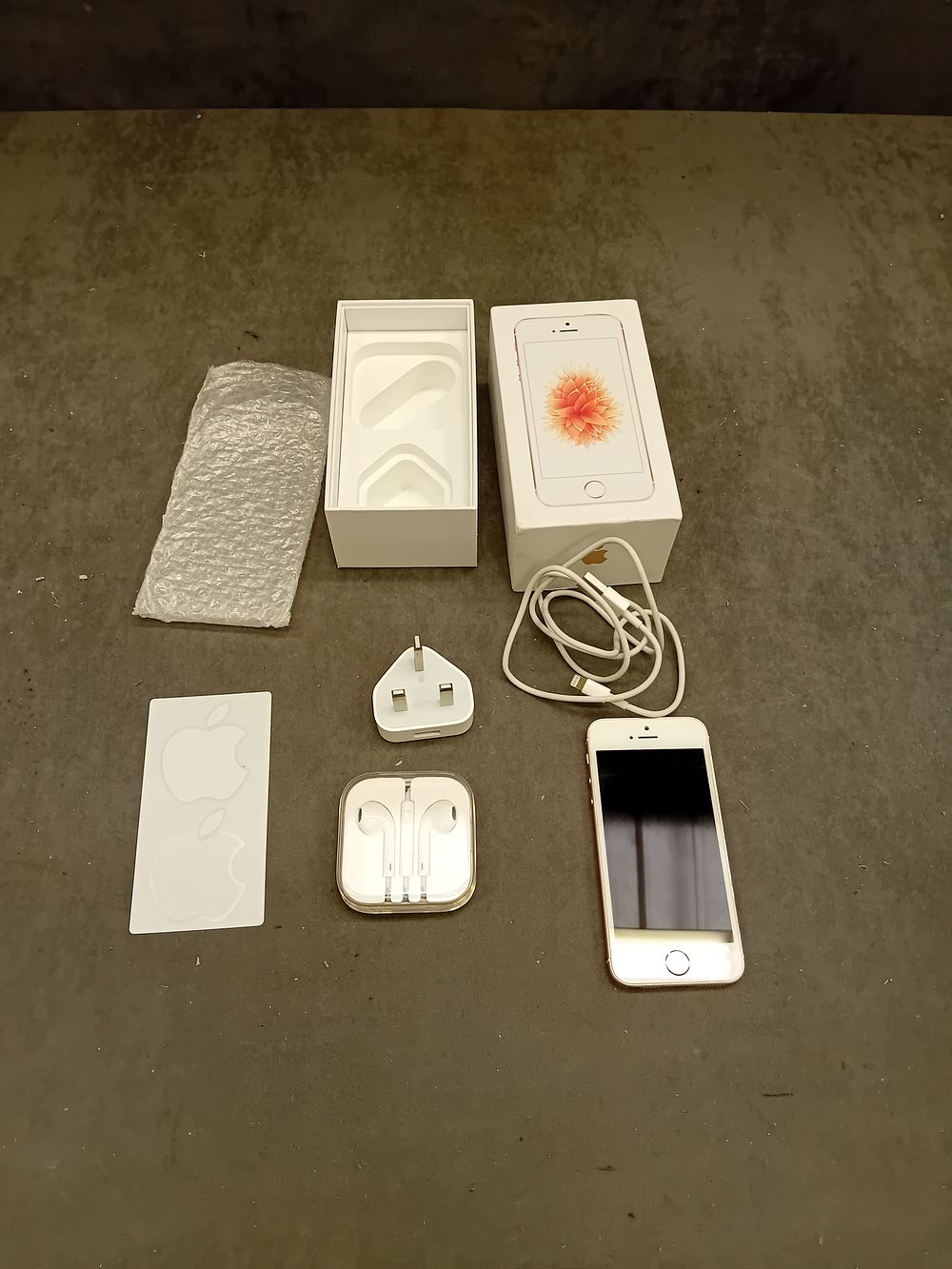 Lot 409: A First-Generation Apple iPhone SE with Original Box and Accessories