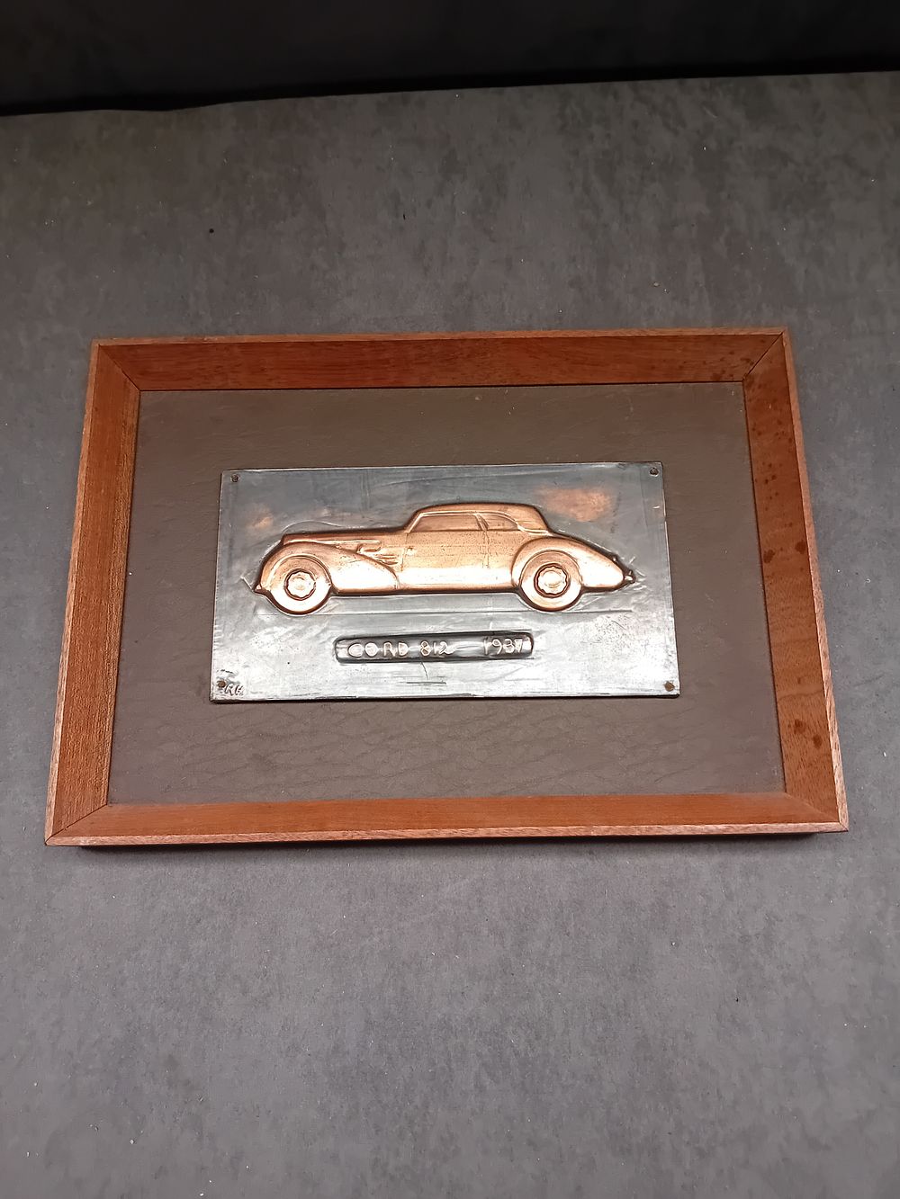 Lot 264: A Hand-Wrought Copper Relief Plaque of a 1937 Cord 812 by Richard C. Hanscomb