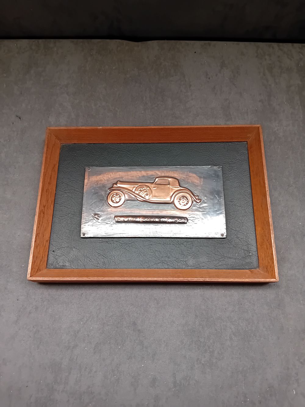 Lot 267: Hand-Wrought Metal Relief Plaque of a Stutz Blackhawk by Richard C. Hanscomb, 1983