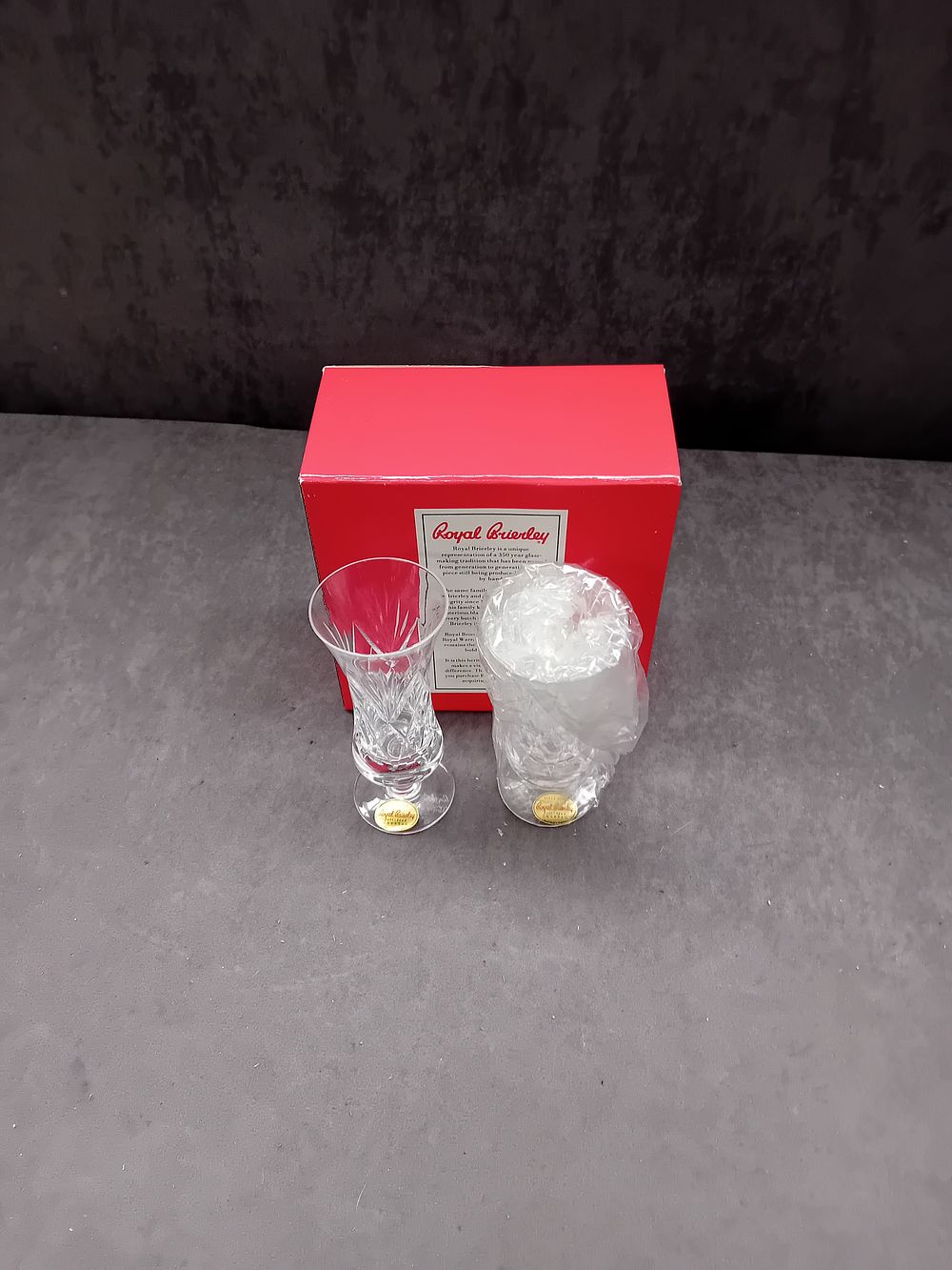 Lot 267: A Pair of Royal Brierley Led Crystal Footed Glasses, with Starburst Pattern
