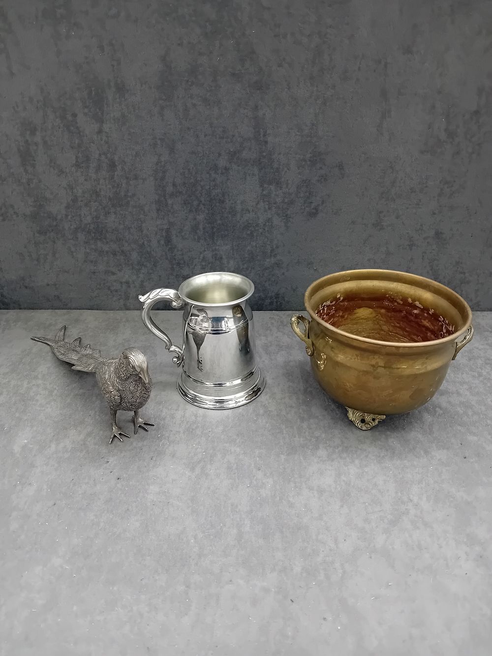 Lot 440: A Group of Three Items: An English Pewter Tankard, a Pheasant Figurine, and a Brass Bowl