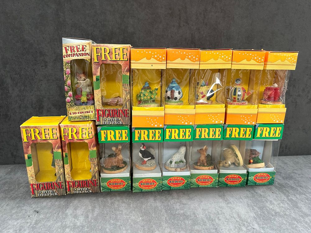 Lot 605: A Collection of 15 Boxed Tetley Tea Folk and Promotional Figurines