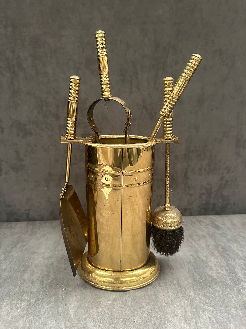 Lot 463: A Four-Piece Brass Fireplace Companion Tool Set with Stand