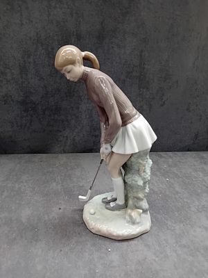 Lladro Lady Golfer Figurine, Model 4851 (Charity Lot - Fight For Sight). A Lladro 'Lady Golfer' 