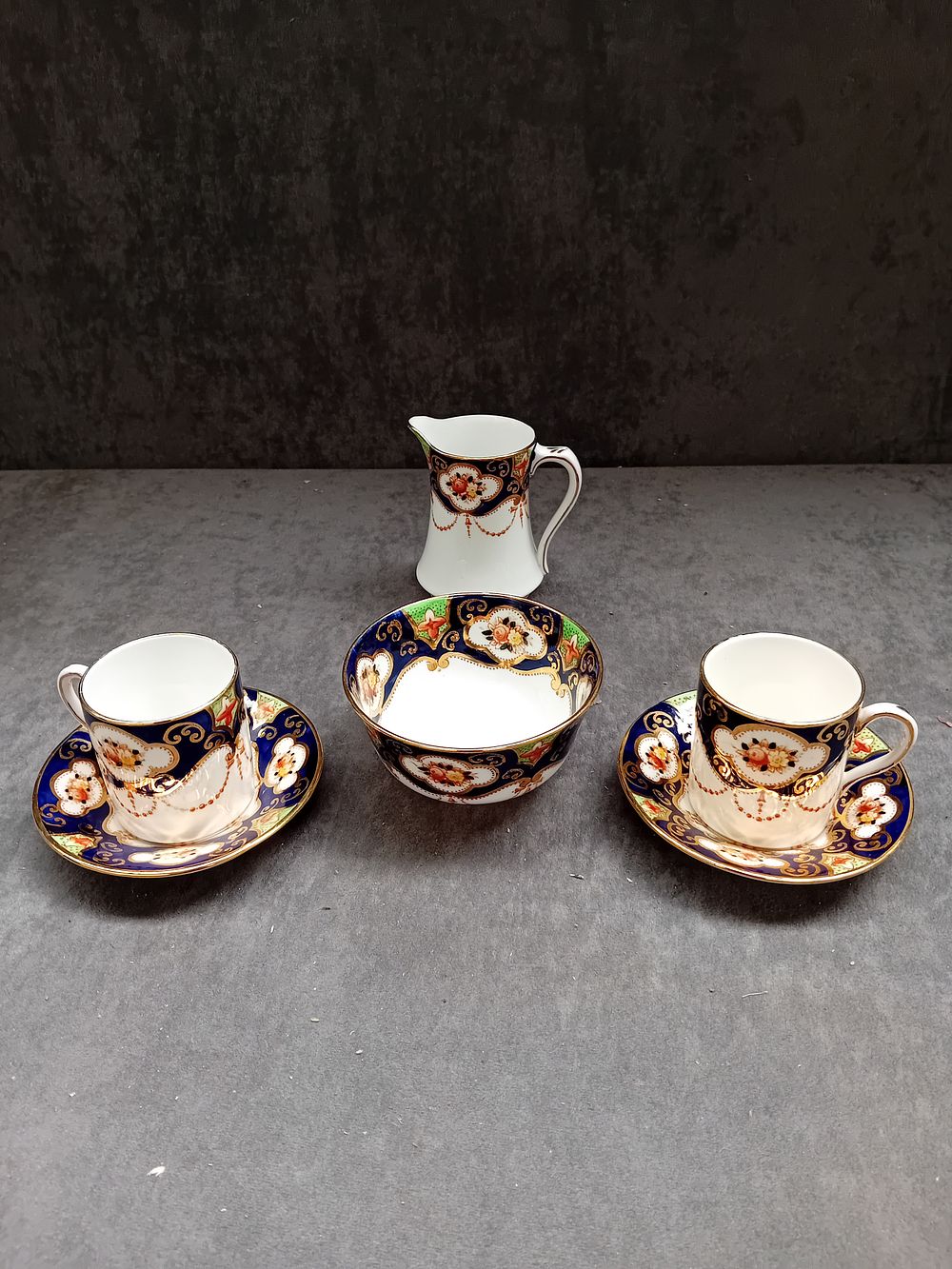 Lot 324: Royal Albert Heirloom Pattern Coffee cups and saucers...