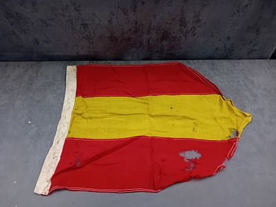 A Spanish Flag, 38cm x 76cm. A Spanish flag, featuring three horizontal stripes: red at the top 