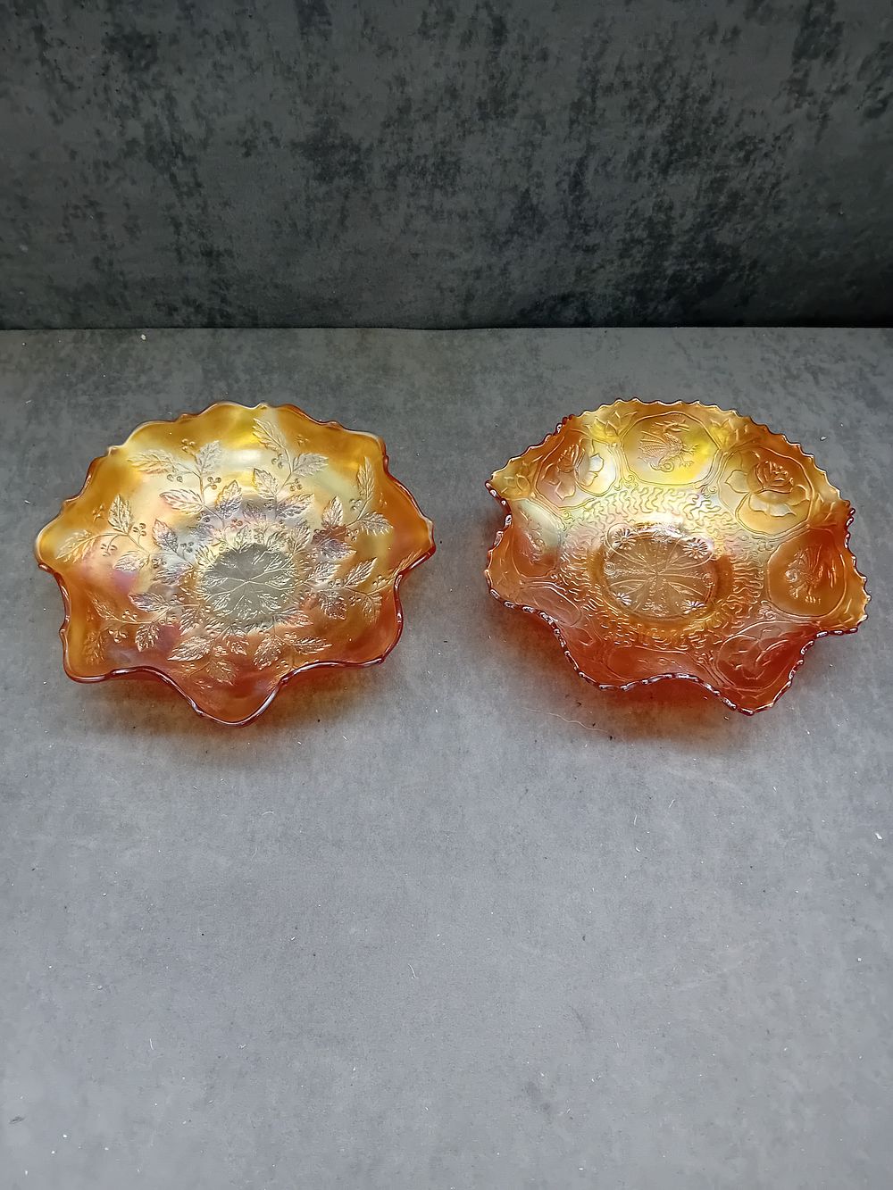 Lot 577: A Pair of Fenton Marigold Carnival Glass Bowls, Dragon & Lotus and Lotus & Poinsettia Patterns
