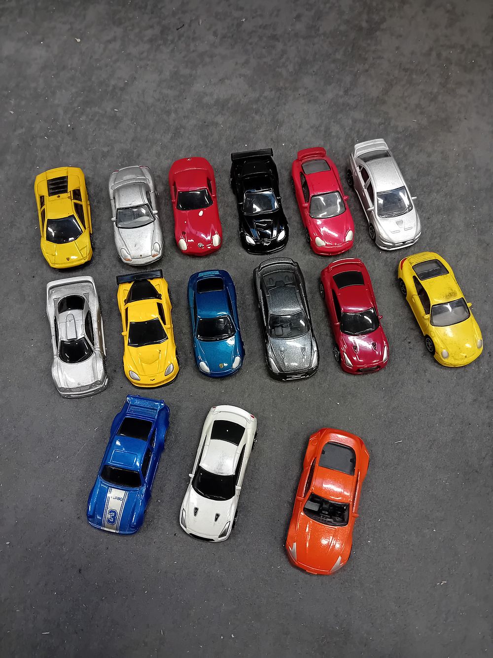 Lot 248: A Collection of 16 Die-Cast Toy Cars by Realtoy and Maisto
