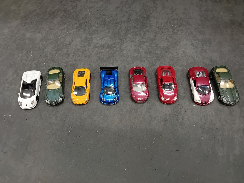 Lot 250: A Collection of Nine Siku Contemporary Die-Cast Model Cars,