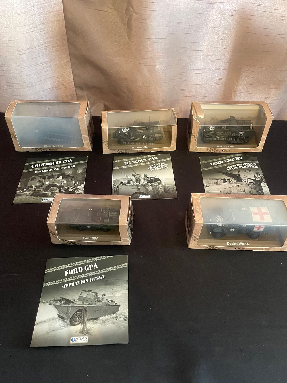 Lot 426: Five Atlas Editions 1:43 Scale Die-Cast Military Vehicle Models, including Chevrolet C8A, M3 Scout Car, 75mm GMC M3, Ford GPA, and Dodge WC54