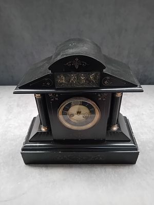 A Late Victorian Black Slate and Marble Mantel Clock. A Late Victorian or French Neo-Classical 