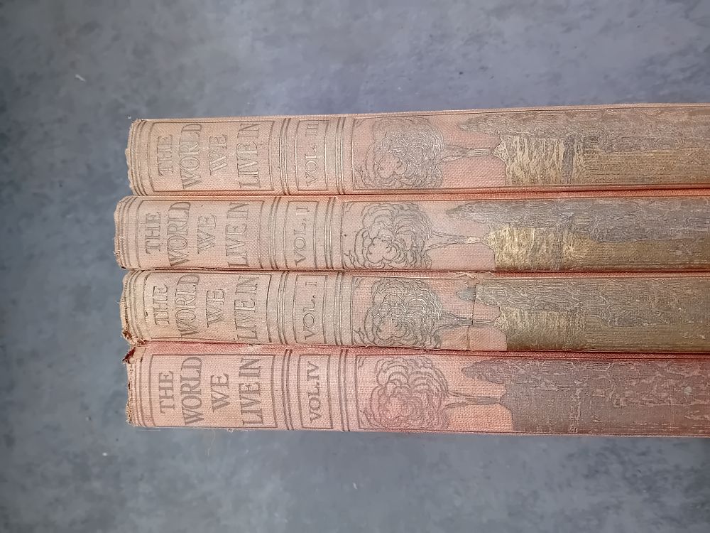 Lot 555: A Collection of 4 Volumes of The World We Live In, Subscriber's Edition