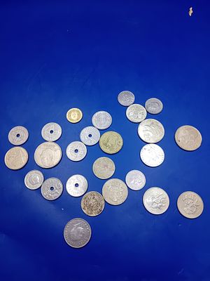 A Collection of 23 Assorted World Coins. A collection of 23 pieces of assorted world coinage. 