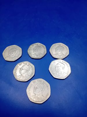 A Collection of 6 Gambia 1 Dalasi 1987 Copper-Nickel Coins. A collection of six octagonal base 