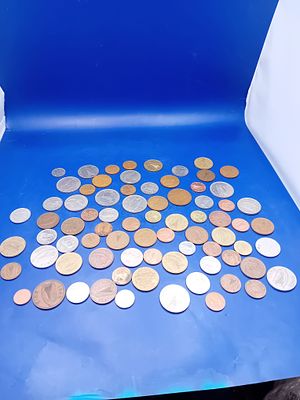 A Collection of 77 Assorted Irish and World Circulating Coins. A collection of 77 assorted 