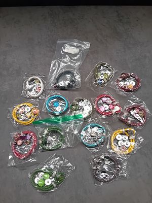 A Collection of 16 Contemporary Snap-Button Costume Bracelets with Interchangeable Rhinestone 