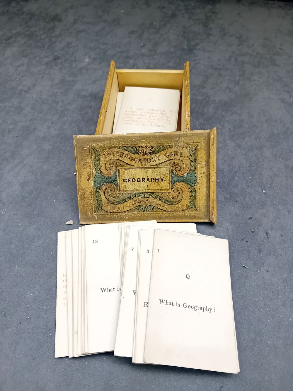 Lot 187: Victorian Era Boxed Educational Card Game, 'Interrogatory Game Geography' by Edward Wallis