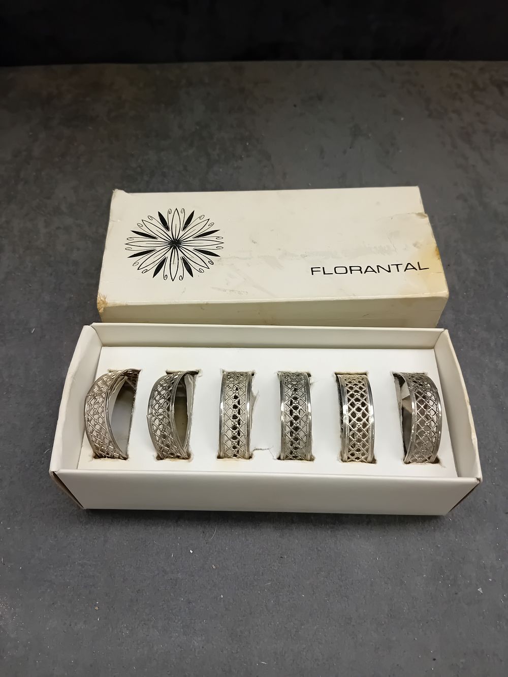 Lot 213: A Set of Six Vintage FLORANTAL Silver Plated Napkin Rings