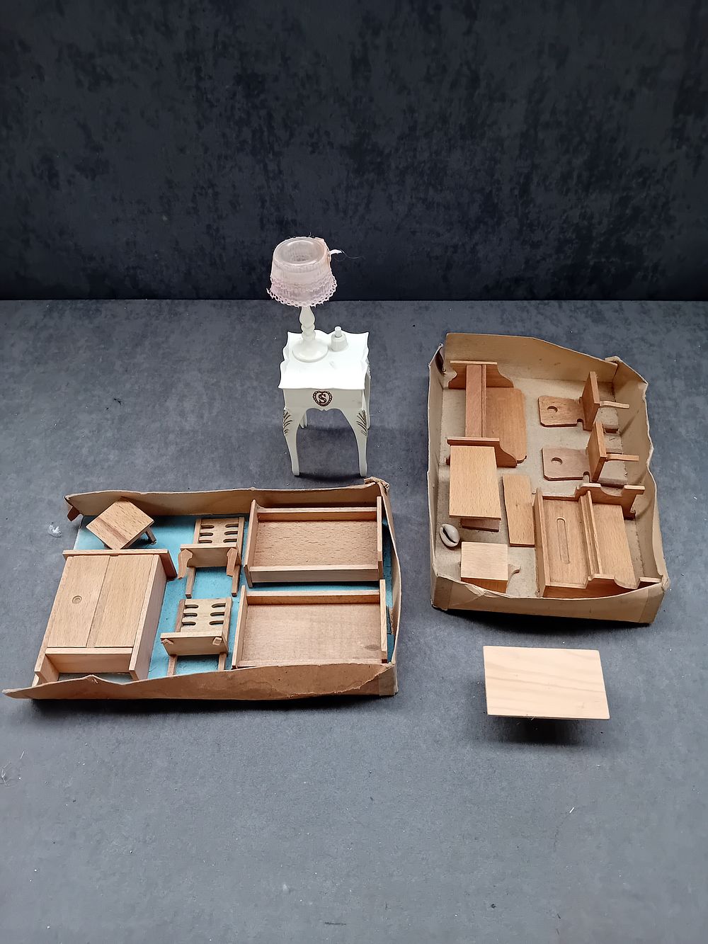 Lot 275: A Collection of 1/24 Scale Unpainted Wooden Dollhouse Furniture DIY Kits and Assembled Plastic Furnishings